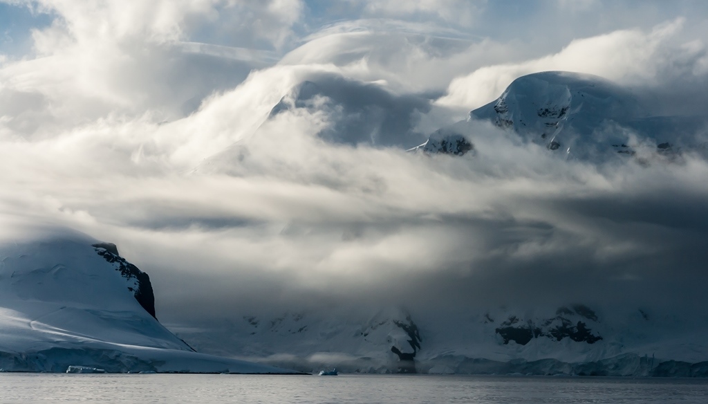 Cloud Filled Mountains of the Neuymayer Channel in Antarctica