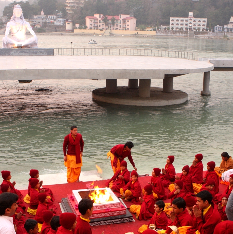 Students of one of the Ashrams praying at the banks of the Ganges